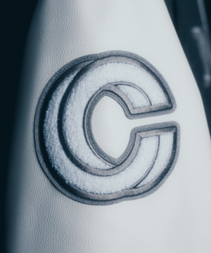 Robert Kraft Patriots varsity jacket designed for playoff fans, combining high-quality materials with classic NFL team styling