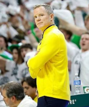 Dusty May Michigan jacket inspired by the Michigan State matchup showcasing classic collegiate basketball fashion