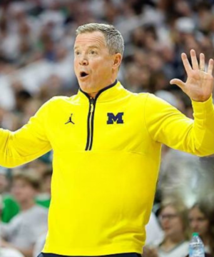 Dusty May Michigan vs Michigan State jacket featuring premium fabric, team-inspired design, and college basketball sideline style