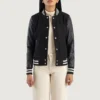 Savant black hybrid varsity jacket featuring premium materials, classic letterman design, and modern streetwear appeal