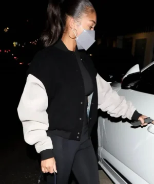 Black and white varsity jacket inspired by Lori Harvey with sleek silhouette, high-quality craftsmanship, and contemporary urban fashion appeal