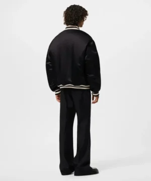Louis Vuitton signature satin bomber jacket showcasing refined detailing, glossy texture, and contemporary luxury streetwear style