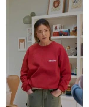 Christa Miller red sweatshirt from Shrinking season 3 featuring casual comfort fit and cozy everyday style