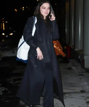Dove Cameron NYC black long coat, stylish celebrity-inspired winter outerwear