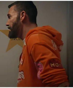 DunKings Super Bowl ad Ben Affleck tracksuit featuring vibrant orange and pink design from Dunkin’ Donuts campaign