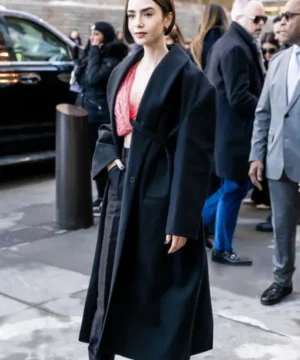 Lily Collins Calvin Klein fashion show black coat featuring sleek tailored silhouette and minimalist runway elegance