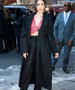 Lily Collins Calvin Klein fashion show black coat featuring sleek tailored silhouette and minimalist runway elegance