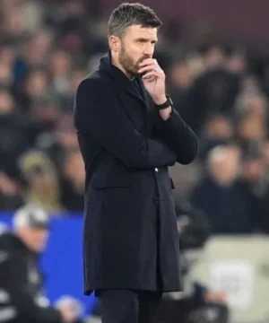 Football-inspired Michael Carrick coat showcasing West Ham vs Manchester United match-day styling and sleek silhouette
