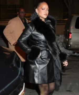 Rihanna New York City black leather coat with plush fur trim collar and high-fashion outerwear appeal