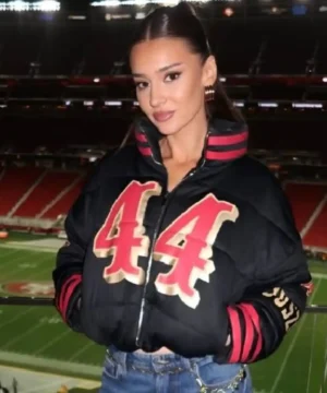 SF 49ers black puffer jacket with Kristin Juszczyk branding, modern insulated fit, and sports fan appeal