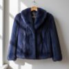 Luxury midnight blue faux fur coat featuring a short classic jacket design with elegant winter style